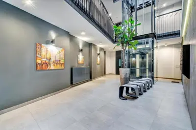 a lobby with a row of chairs and a plant at HaPPy Inn Ugnė, The studio is in the heart of the old town, self-check-in, car-parking in Vilnius
