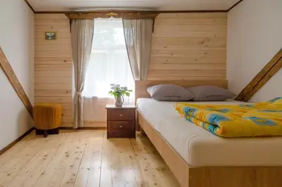 a bedroom with a bed and a window at Skiemonių Dvaras in Skiemonys