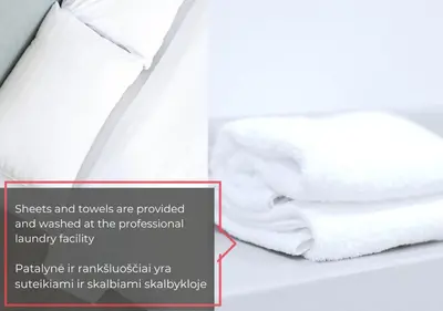 a pile of towels sitting on top of a bed at Art Boutique I Old Town Apartments w-AC I cohost in Vilnius