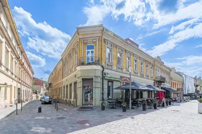 a building on a street in a city at Serenade Old Town apartment with AC in Kaunas