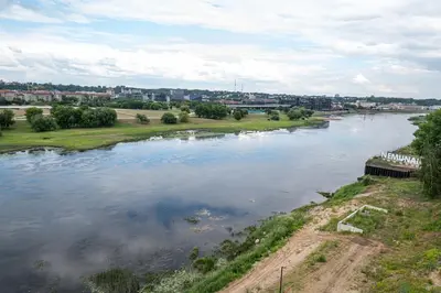 a view of a river with a city in the background at AMJ Royal Apartments - 120 - Royal Classic in Kaunas