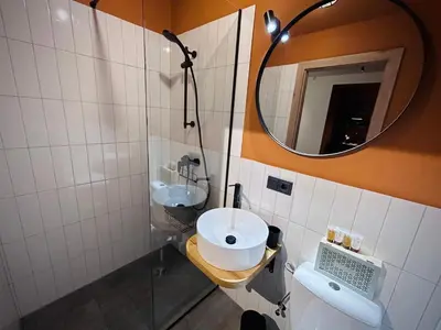 a bathroom with a sink and a mirror at Platforma2b eco in Šiauliai