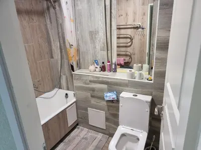a bathroom with a white toilet and a sink at Kaunas 174 in Kaunas