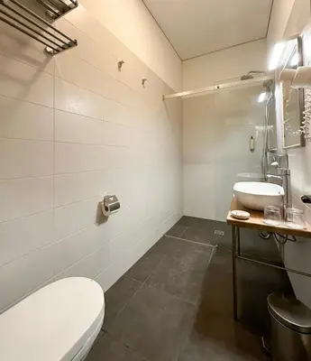 a bathroom with a toilet and a sink at New Town Home 2 in Vilnius