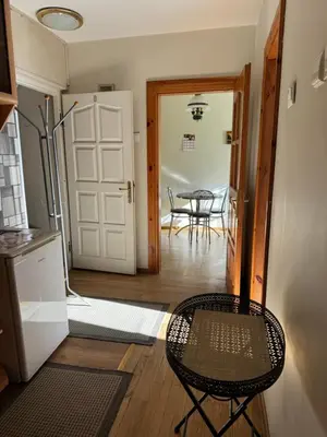 a kitchen and dining room with a table and chairs at Danarent Tilto in Vilnius