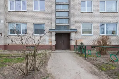 a brick building with a door in front of it at Apartment Dandelion by Polo Apartments in Kaunas