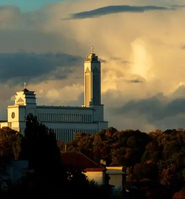 a large white building with a clock tower on top at Apartamentai Zibutės in Kaunas