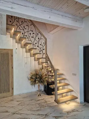 a staircase in a living room with a plant at Modern design in quiet nature
