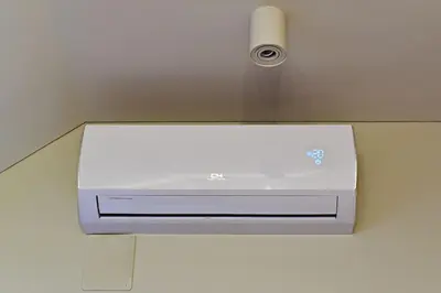 a air conditioner on a wall in a room at Domillion New modern Vilnius old town studio U2303 in Vilnius