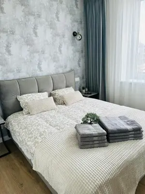 a bedroom with a bed with two pillows on it at Stylish Apartment 5 min from Kaunas Clinics in Kaunas