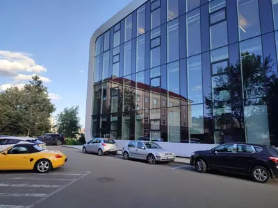 a group of cars parked in front of a building at SimpleStayVilnius in Vilnius