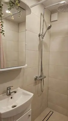 a bathroom with a shower and a sink at Kambarių nuoma Kaune Taikos pr in Kaunas