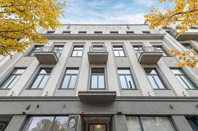a large white building with a sign on it at Vytauto 43 Residence 9 by Domvia in Kaunas