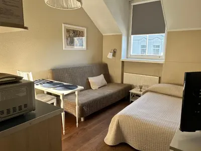 a small living room with a couch and a table at G-45 in Vilnius