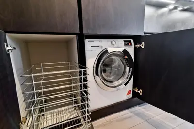 a washer and dryer in a laundry room at City Center Loft in Kaunas