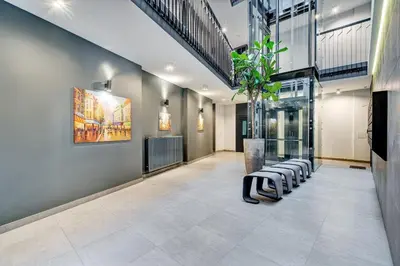 a lobby with a row of chairs and a plant at Downtown apartment in Vilnius str. in Vilnius