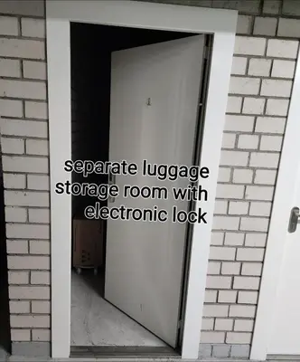 an open door with the words separate language storage room with electronic lock at HaPPy Inn GOLD Studio, self check-in, Parking in the underground garage in Vilnius