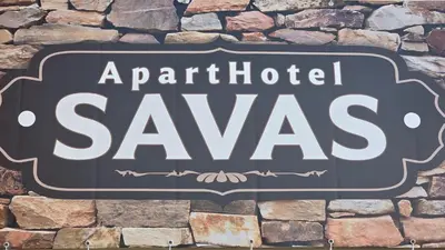 a sign that reads artificial savas on a stone wall at ApartHotel SAVAS 3 Studio and parking in Kaunas