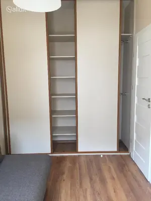 an empty closet with white walls and wooden floors at Close to PANORAMA center apartment Self check-in Garage free in Vilnius