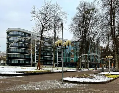 a street light in front of a building at Pink Peony in Druskininkai