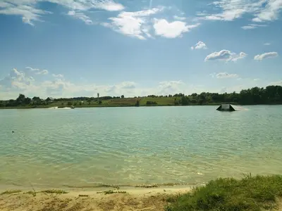 a large body of water with a boat in it at Gilužio Rivjera in Vilnius
