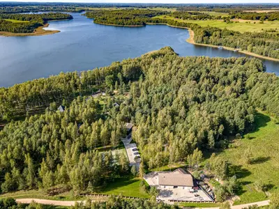 an aerial view of an island in the middle of a lake at Paplūdimio namukas in Molėtai