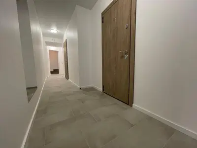 a hallway with a door and a tile floor at Modern guest house in city center I Room 3 in Vilnius